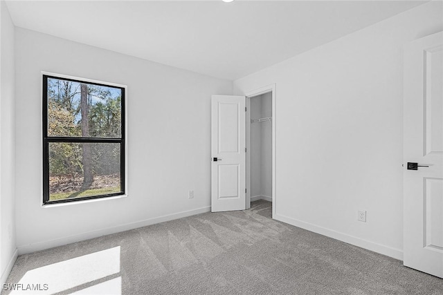 735 La Plata Ave, Lehigh Acres, FL 33974 - unfurnished bedroom featuring carpet and baseboards
