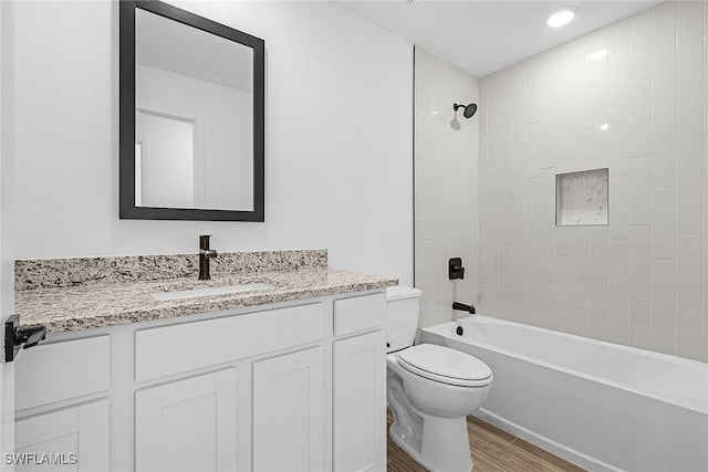 735 La Plata Ave, Lehigh Acres, FL 33974 - bathroom with wood finished floors, vanity, and shower / bath combination