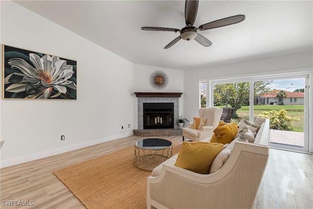6340 P G A Dr, North Fort Myers, FL 33917 - living area featuring wood finished floors, ceiling fan, and a brick fireplace