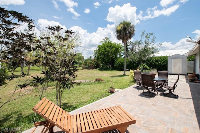 6340 P G A Dr, North Fort Myers, FL 33917 - view of patio with outdoor dining area and a storage shed