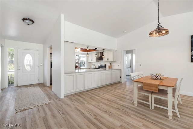 6340 P G A Dr, North Fort Myers, FL 33917 - entryway with light wood-style floors, healthy amount of natural light, and high vaulted ceiling