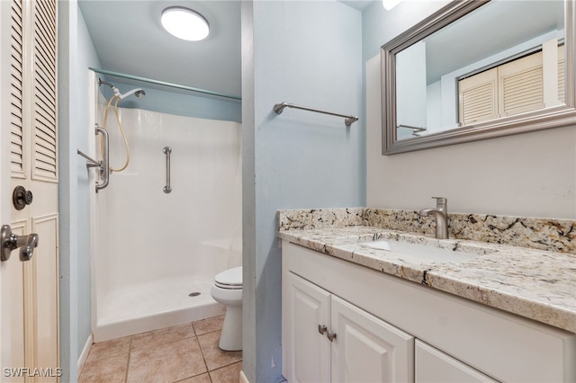 4198 27th Ct SW Unit 105, Naples, FL 34116 - bathroom with vanity, a shower, and tile patterned flooring
