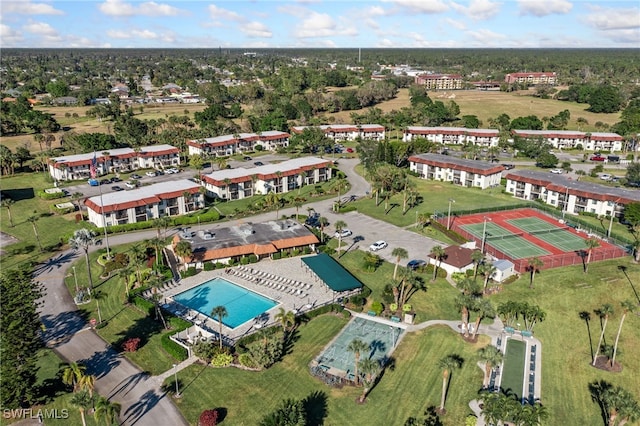 4198 27th Ct SW Unit 105, Naples, FL 34116 - aerial view of property and surrounding area featuring a pool area