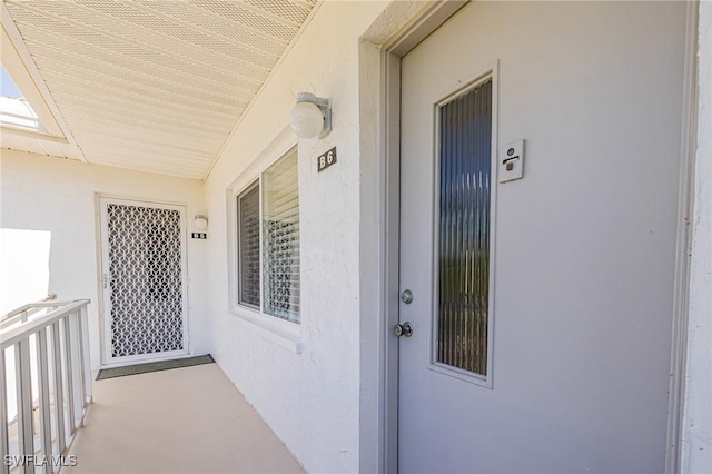 431 Van Buren St Unit B6, Fort Myers, FL 33916 - view of exterior entry featuring stucco siding
