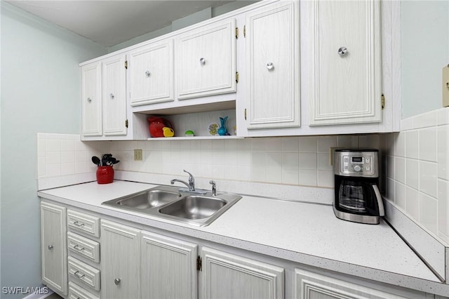 431 Van Buren St Unit B6, Fort Myers, FL 33916 - kitchen featuring light countertops, open shelves, tasteful backsplash, and white cabinets