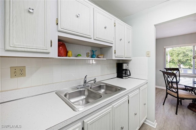 431 Van Buren St Unit B6, Fort Myers, FL 33916 - kitchen with light countertops, white cabinets, tasteful backsplash, and open shelves