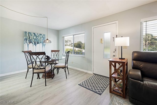 431 Van Buren St Unit B6, Fort Myers, FL 33916 - dining space with light wood-style floors and baseboards