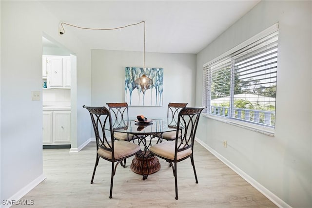 431 Van Buren St Unit B6, Fort Myers, FL 33916 - dining area with light wood finished floors and baseboards