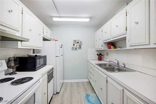 431 Van Buren St Unit B6, Fort Myers, FL 33916 - kitchen with white appliances, decorative backsplash, light countertops, and white cabinets