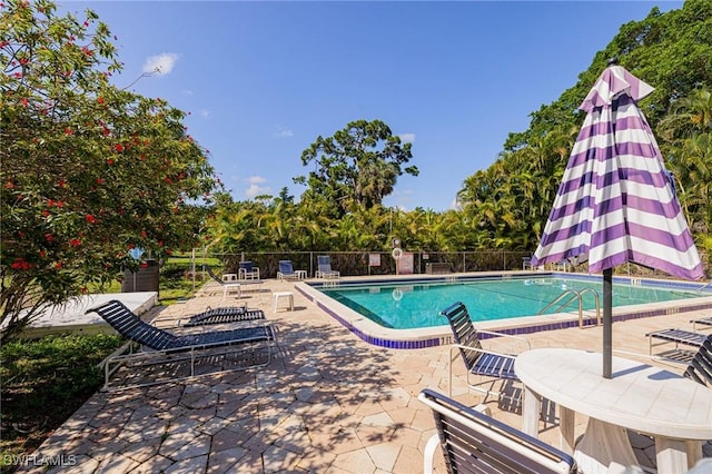 431 Van Buren St Unit B6, Fort Myers, FL 33916 - community pool featuring a patio and view of scattered trees