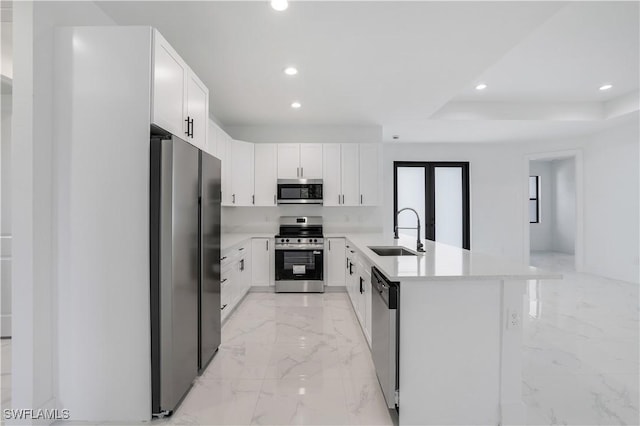 3644 35th Ave NE, Naples, FL 34120 - kitchen featuring stainless steel appliances, light marble finish flooring, recessed lighting, light countertops, and white cabinets
