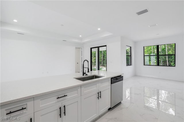 3644 35th Ave NE, Naples, FL 34120 - kitchen with stainless steel dishwasher, open floor plan, plenty of natural light, light marble finish floors, and recessed lighting