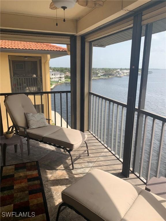 4015 SE 20th Pl Unit 503, Cape Coral, FL 33904 - balcony featuring a water view and a ceiling fan