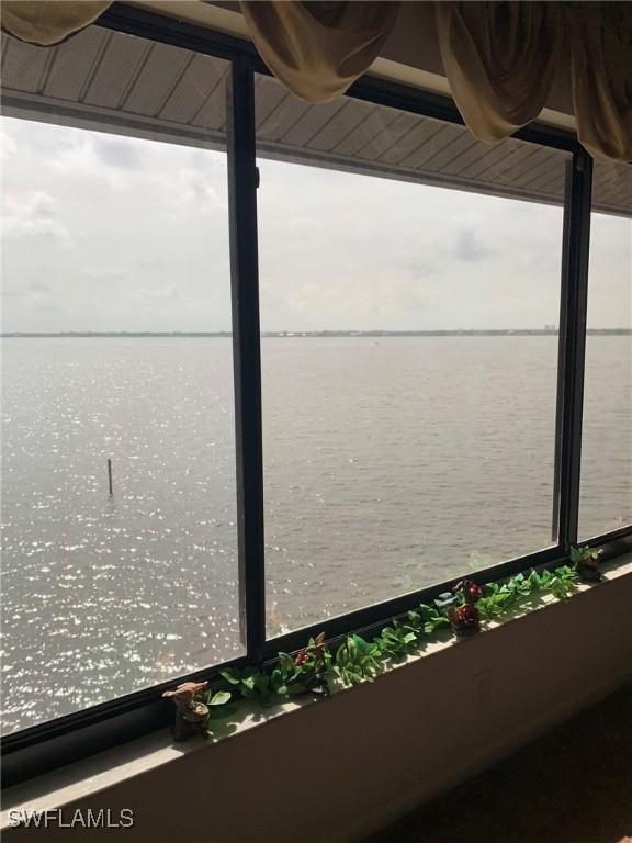 4015 SE 20th Pl Unit 503, Cape Coral, FL 33904 - dock featuring a water view