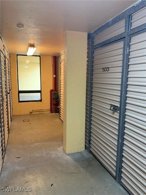 4015 SE 20th Pl Unit 503, Cape Coral, FL 33904 - hallway with concrete floors and a baseboard heating unit