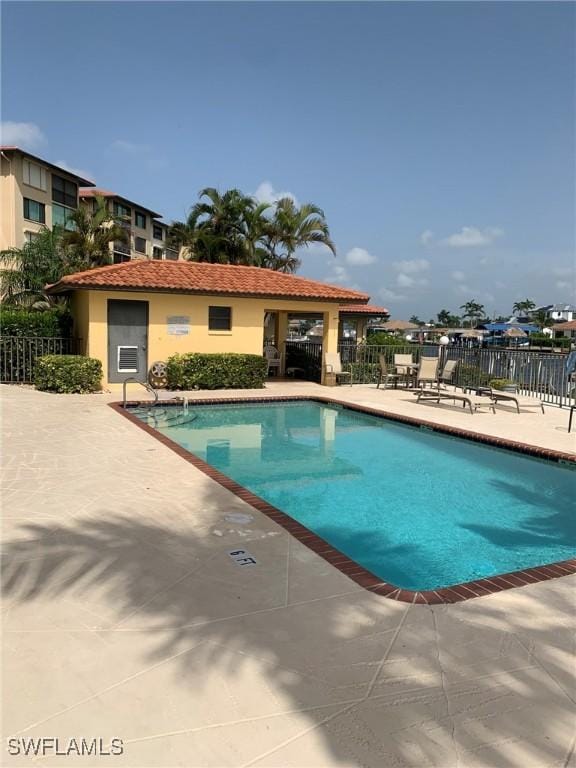 4015 SE 20th Pl Unit 503, Cape Coral, FL 33904 - community pool with a patio area