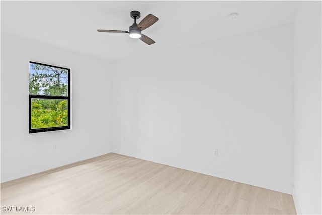 1061 Sunrise Blvd, Lehigh Acres, FL 33974 - unfurnished room featuring light wood-style flooring, ceiling fan, and a smoke detector
