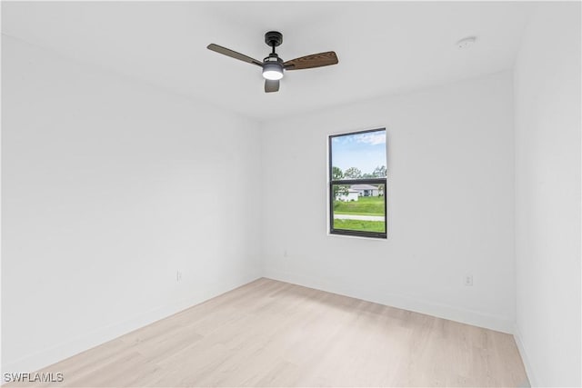1061 Sunrise Blvd, Lehigh Acres, FL 33974 - empty room with light wood-type flooring, ceiling fan, and a smoke detector
