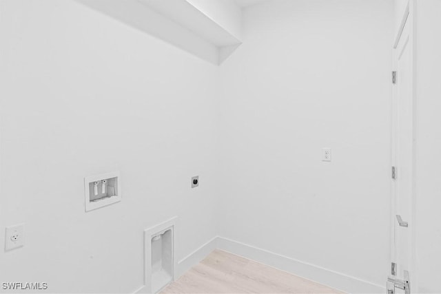 1061 Sunrise Blvd, Lehigh Acres, FL 33974 - washroom with hookup for an electric dryer, light wood-style floors, and hookup for a washing machine