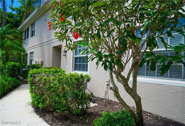 7120 Timberland Cir Unit 101, Naples, FL 34109 - view of side of property featuring stucco siding