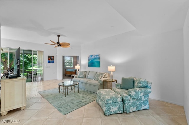 7120 Timberland Cir Unit 101, Naples, FL 34109 - living room with tile patterned floors and a ceiling fan