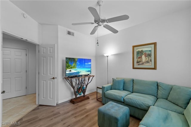 7120 Timberland Cir Unit 101, Naples, FL 34109 - living area with a ceiling fan and light wood finished floors