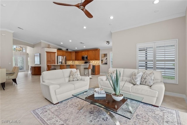 2434 Butterfly Palm Dr, Naples, FL 34119 - living room with ornamental molding, plenty of natural light, recessed lighting, lofted ceiling, and a ceiling fan