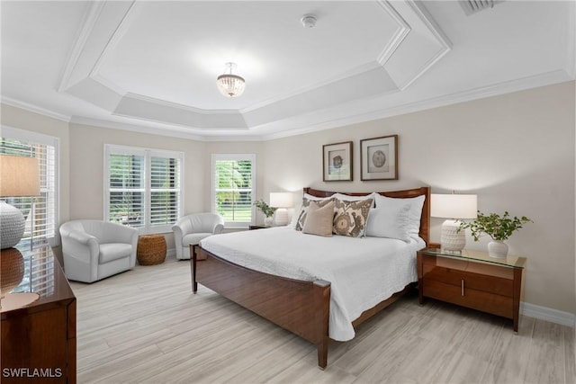 2434 Butterfly Palm Dr, Naples, FL 34119 - bedroom featuring a tray ceiling, ornamental molding, a chandelier, and wood finished floors