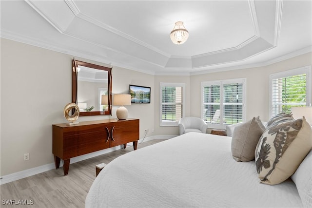 2434 Butterfly Palm Dr, Naples, FL 34119 - bedroom featuring a tray ceiling, ornamental molding, and wood finished floors