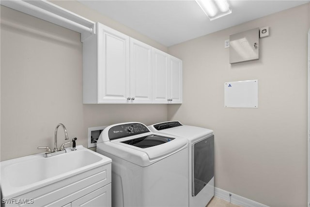 2434 Butterfly Palm Dr, Naples, FL 34119 - washroom with washing machine and clothes dryer and cabinet space