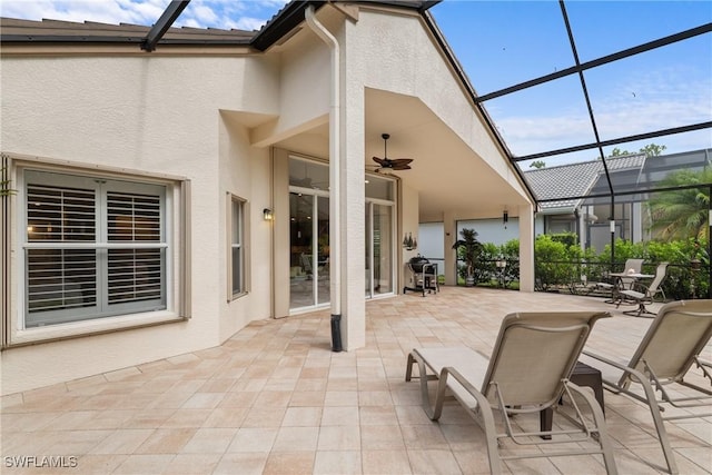 2434 Butterfly Palm Dr, Naples, FL 34119 - view of patio / terrace with glass enclosure and ceiling fan