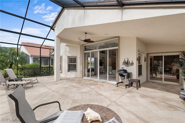 2434 Butterfly Palm Dr, Naples, FL 34119 - view of patio / terrace featuring glass enclosure and a ceiling fan