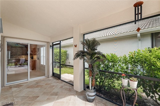 2434 Butterfly Palm Dr, Naples, FL 34119 - unfurnished sunroom with vaulted ceiling
