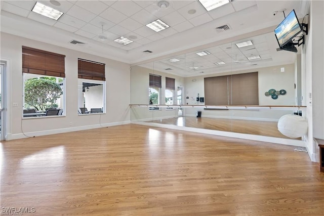 2434 Butterfly Palm Dr, Naples, FL 34119 - exercise area with a paneled ceiling and light wood finished floors