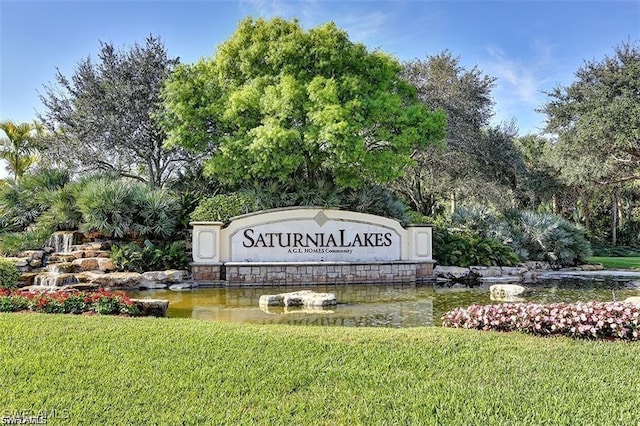 2434 Butterfly Palm Dr, Naples, FL 34119 - community / neighborhood sign featuring a yard