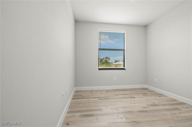 3006 72nd St W, Lehigh Acres, FL 33971 - empty room featuring light wood-type flooring and baseboards