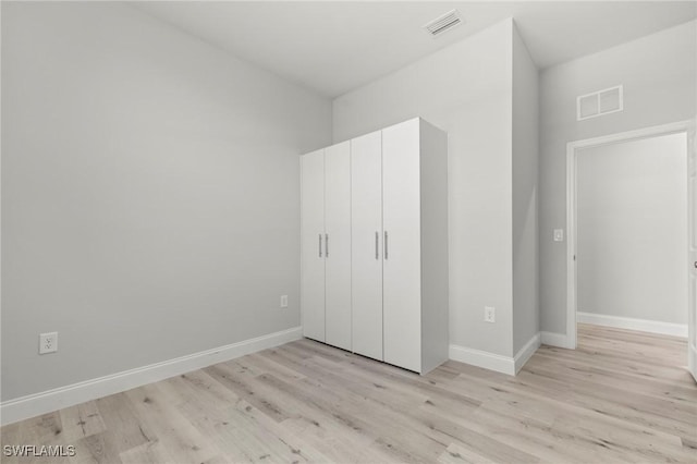 3006 72nd St W, Lehigh Acres, FL 33971 - unfurnished bedroom featuring light wood-style flooring and baseboards