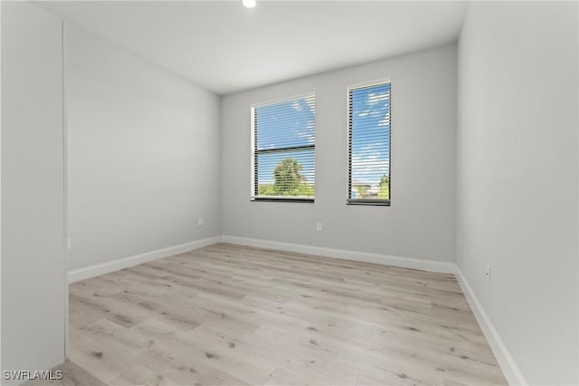 3006 72nd St W, Lehigh Acres, FL 33971 - unfurnished room with light wood-type flooring and recessed lighting