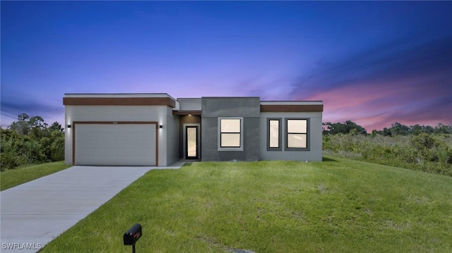 3006 72nd St W, Lehigh Acres, FL 33971 - contemporary home featuring a garage, driveway, a front yard, and stucco siding