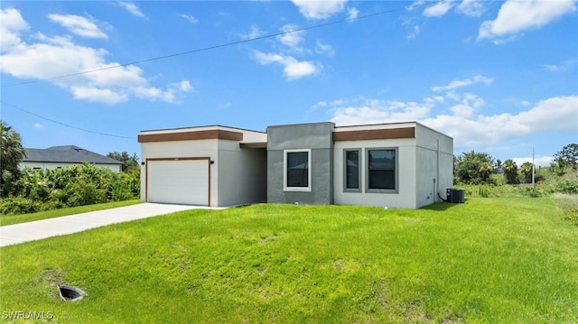 3006 72nd St W, Lehigh Acres, FL 33971 - contemporary home with a garage, driveway, a front yard, and stucco siding