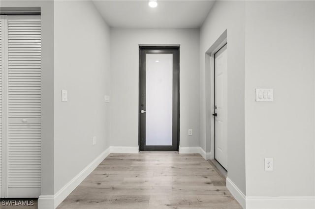 3006 72nd St W, Lehigh Acres, FL 33971 - foyer entrance featuring light wood finished floors and baseboards