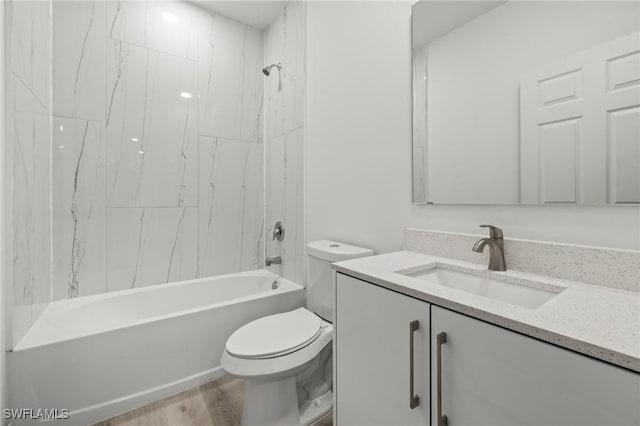 3006 72nd St W, Lehigh Acres, FL 33971 - full bath with vanity, washtub / shower combination, and wood finished floors