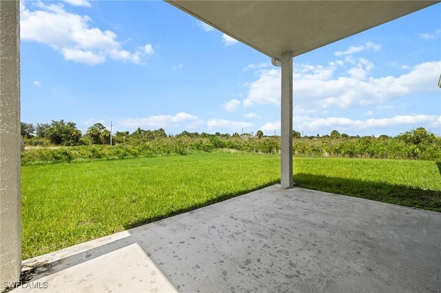 3006 72nd St W, Lehigh Acres, FL 33971 - view of grassy yard with a patio and a rural view