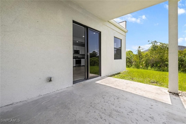 3006 72nd St W, Lehigh Acres, FL 33971 - view of patio / terrace