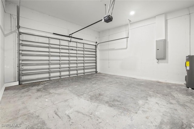 3006 72nd St W, Lehigh Acres, FL 33971 - garage featuring electric panel, a garage door opener, and electric water heater
