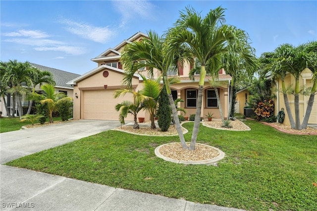 10043 Winding River Rd, Punta Gorda, FL 33950 - mediterranean / spanish-style house featuring concrete driveway, stucco siding, a front yard, and an attached garage