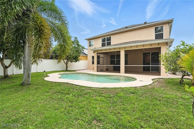 10043 Winding River Rd, Punta Gorda, FL 33950 - back of house with a sunroom, stucco siding, a fenced backyard, and a patio area