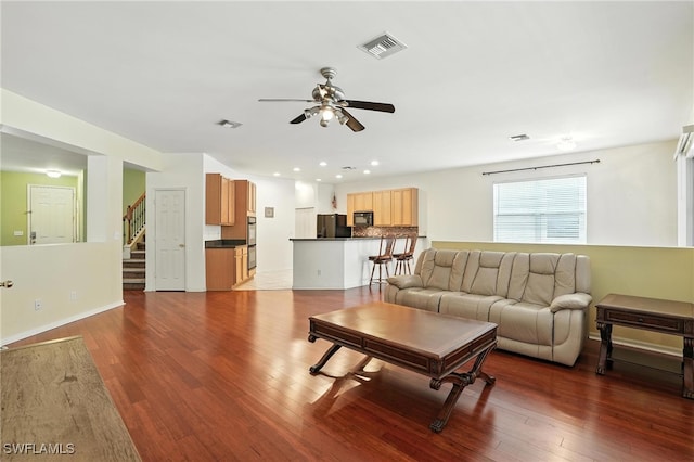 10043 Winding River Rd, Punta Gorda, FL 33950 - living room with a ceiling fan, wood finished floors, stairway, and recessed lighting