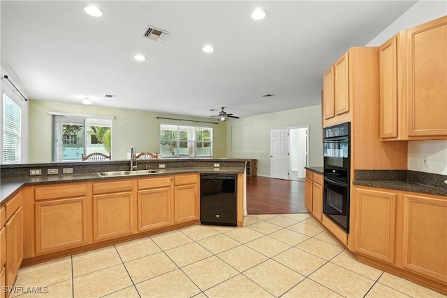 10043 Winding River Rd, Punta Gorda, FL 33950 - kitchen with black appliances, a ceiling fan, light tile patterned floors, and recessed lighting