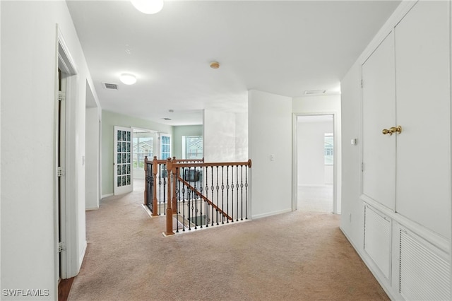 10043 Winding River Rd, Punta Gorda, FL 33950 - hallway featuring an upstairs landing and light colored carpet